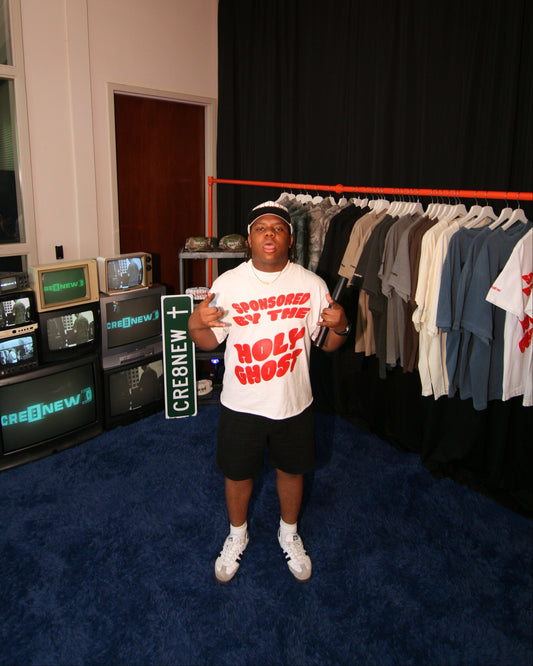 model wearing a white oversized sponsored by the holy ghost christian merch from faith-based apparel brand-CRE8NEW