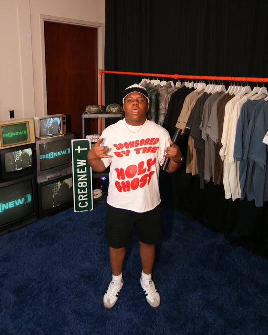 model wearing a white oversized sponsored by the holy ghost christian merch from faith-based apparel brand-CRE8NEW